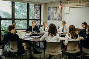 Students sitting around a table.